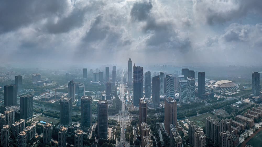 City Under Overcast Sky by Irene Wu — canvas wall art