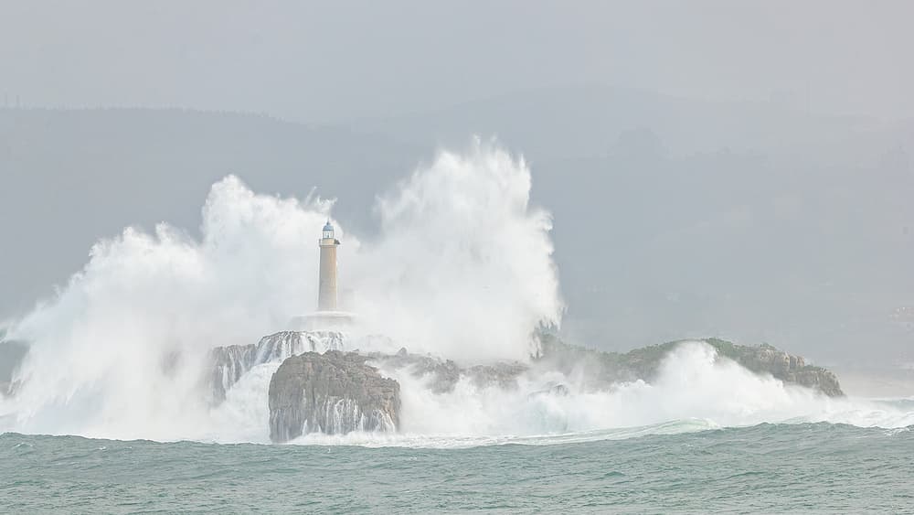 Lighthouse and Crashing Waves by Joan Gil Raga — canvas wall art