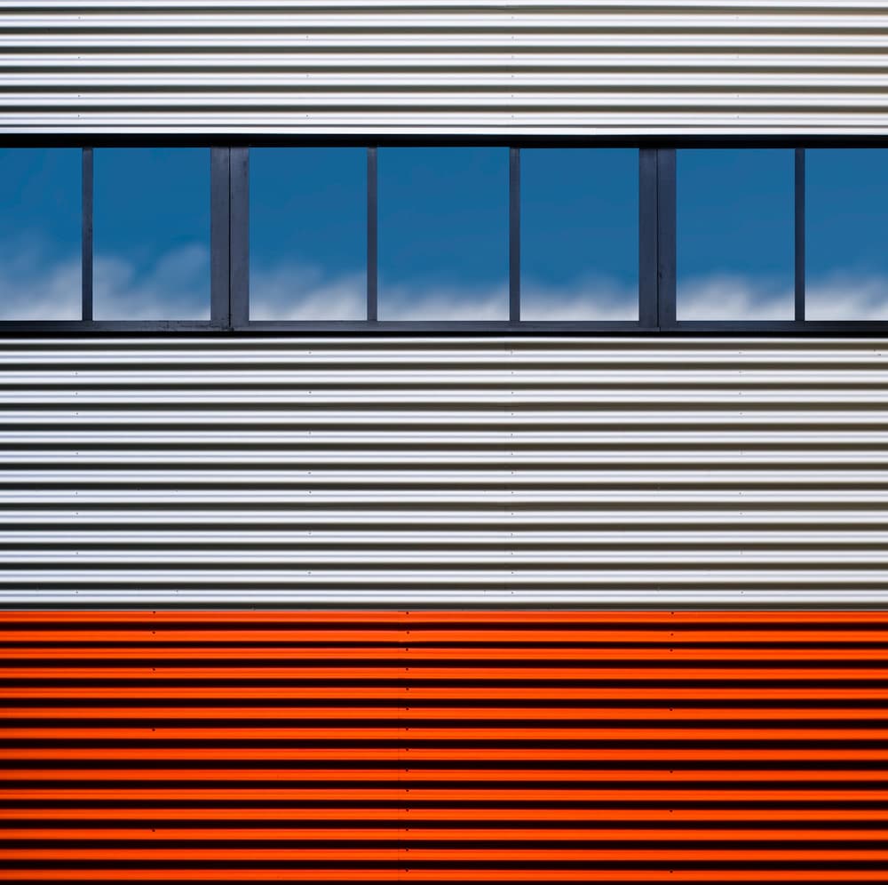 Orange Corrugated Facade by Luc Vangindertael (laGrange) — canvas wall art