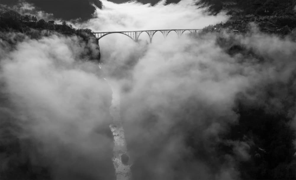 Bridge Over Foggy River by Radojica Jevric fotorax — canvas wall art