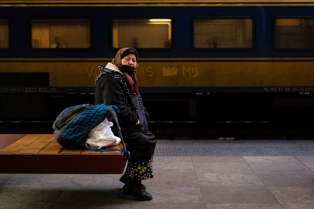 Elderly Woman Waiting Train by Lus Joosten — canvas wall art
