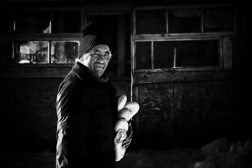 Warm Bread Winter Man by Marius Cinteza — canvas wall art