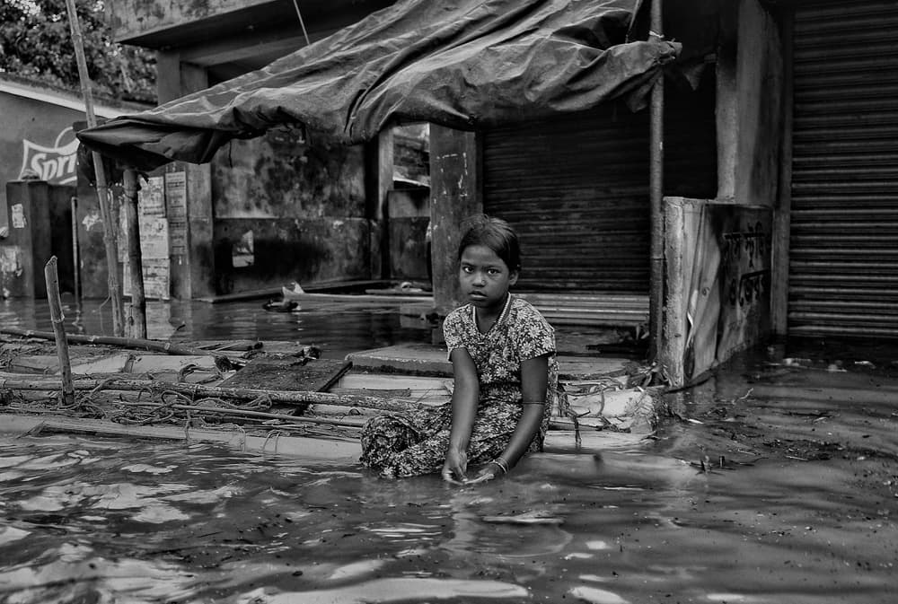 Solemn Girl in Flood by Avishek Das — canvas wall art