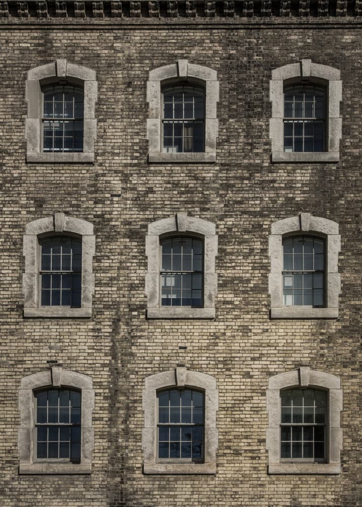 Aged Brick Building Windows by The Learning Curve Photography — canvas wall art