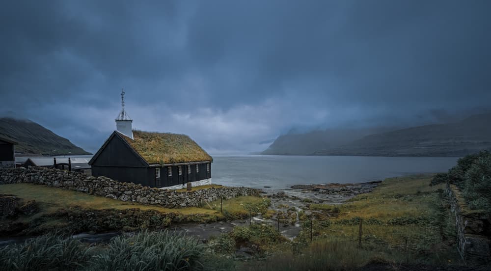 Moody Fjord Church by Kenneth-Wei Zeng — canvas wall art