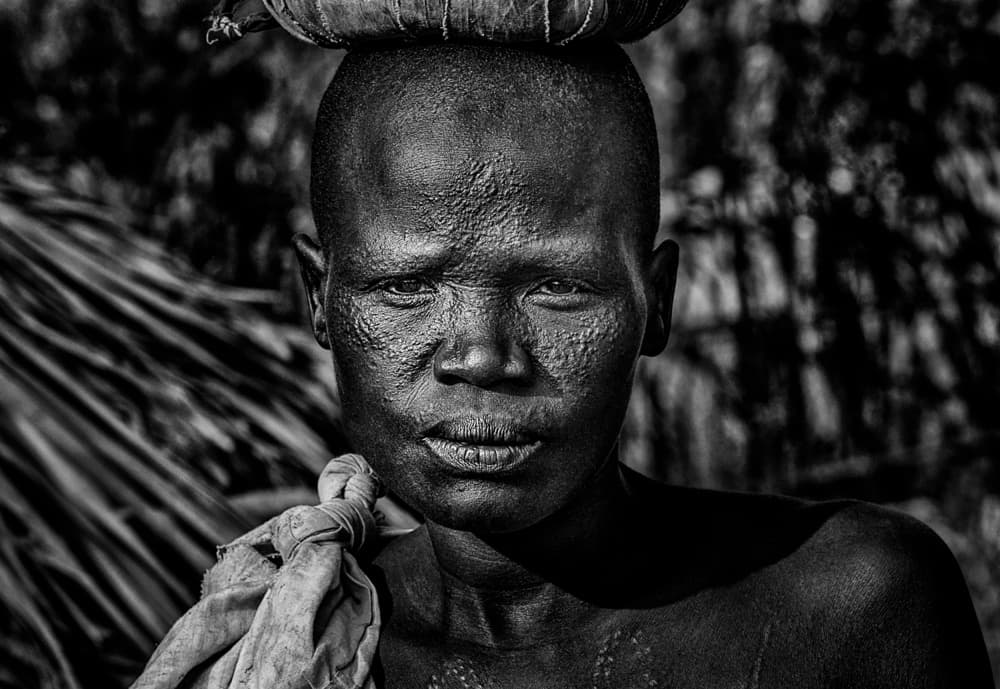 African Tribal Portrait by Joxe Inazio Kuesta Garmendia — canvas wall art