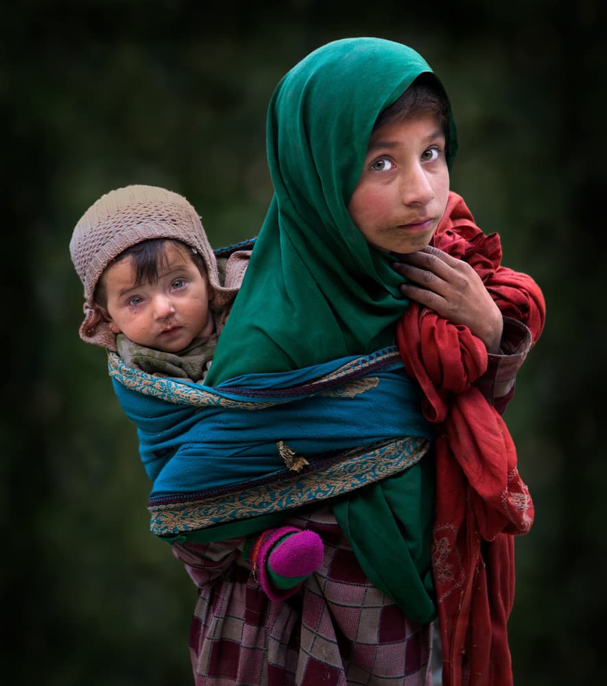 Big Sister Carrying Baby by Sayyed Nayyer Reza — canvas wall art