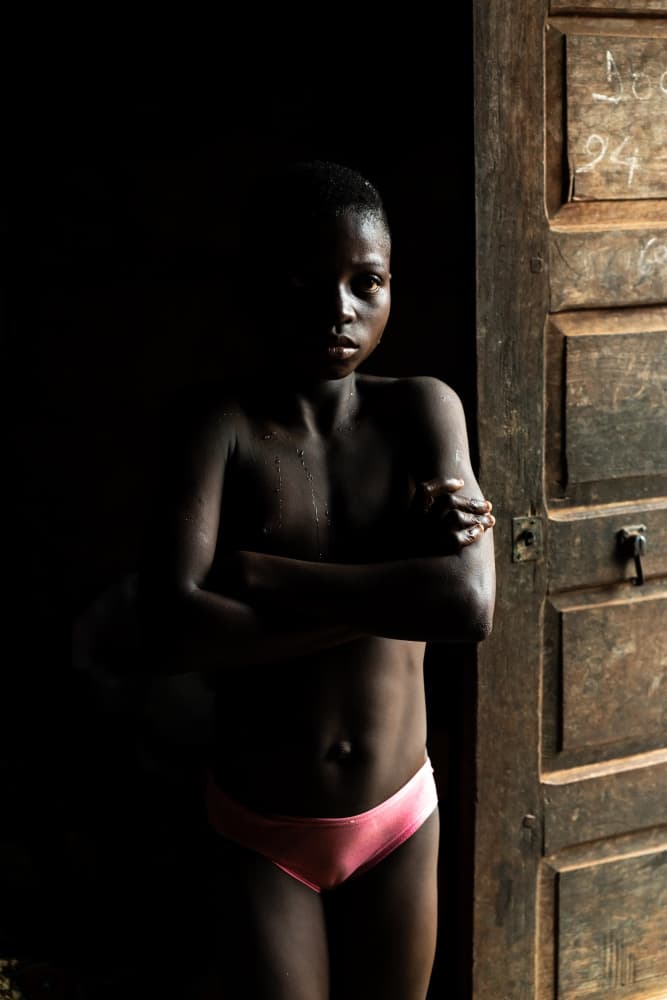 Pensive Boy In Doorway by Corinne Spector — canvas wall art