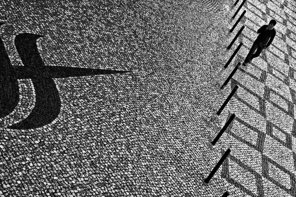 Man Walking Geometric Shadows by Paulo Abrantes — canvas wall art