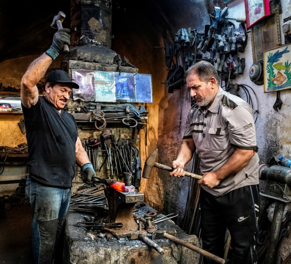 Artisan Blacksmiths At Work by Bashar Alsofey — canvas wall art
