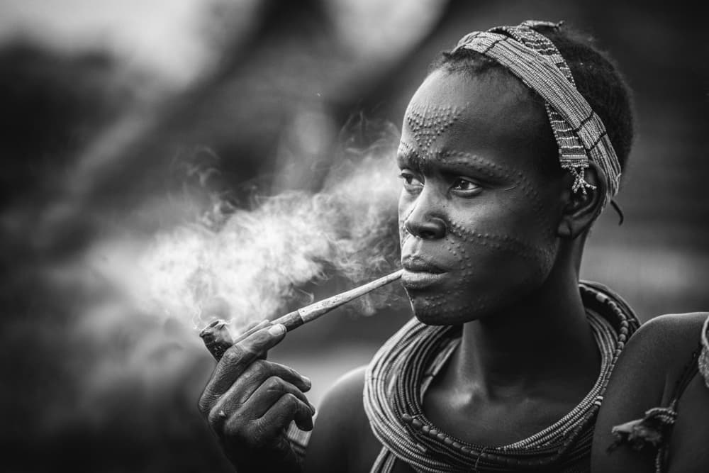 Tribal Person Smoking Pipe by Trevor Cole — canvas wall art