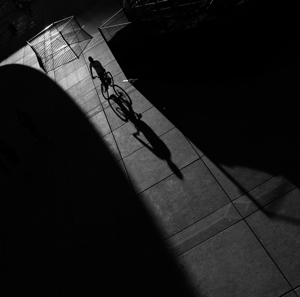 Cyclist's Long Shadow by Jian Wang — canvas wall art