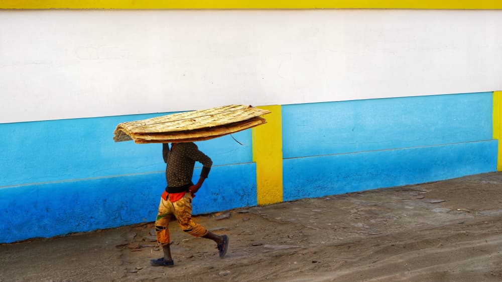 Man Carrying Woven Load by txules — canvas wall art