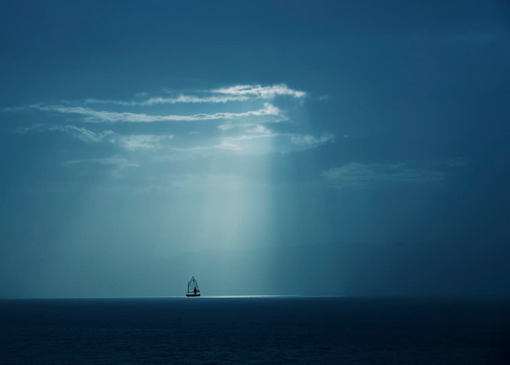 Solitary Sailboat Rays by Ibrahim Nabeel — canvas wall art