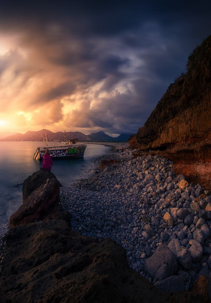 Lone Figure Sunset Shipwreck by joanaduenas — canvas wall art