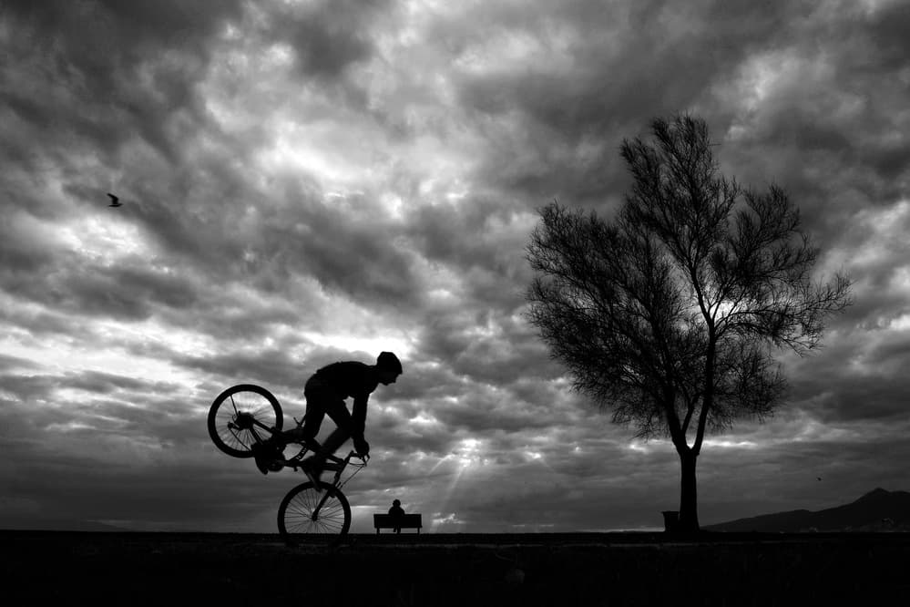 Biker Under Stormy Sky by Ali Ayer — canvas wall art