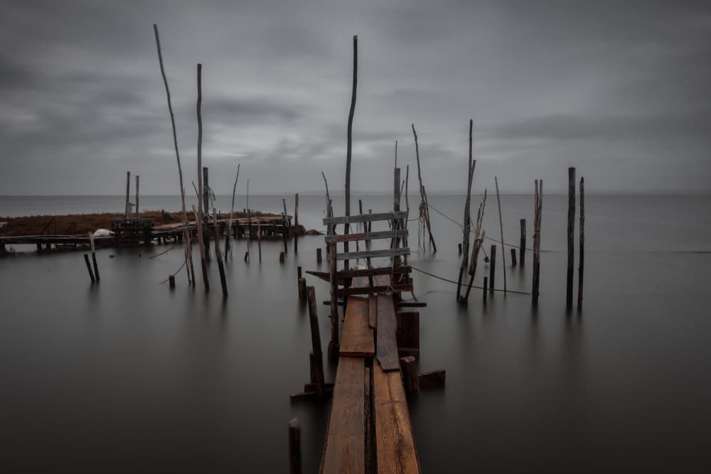 Moody Coastal Pier by Tomás Hueso Marco — canvas wall art