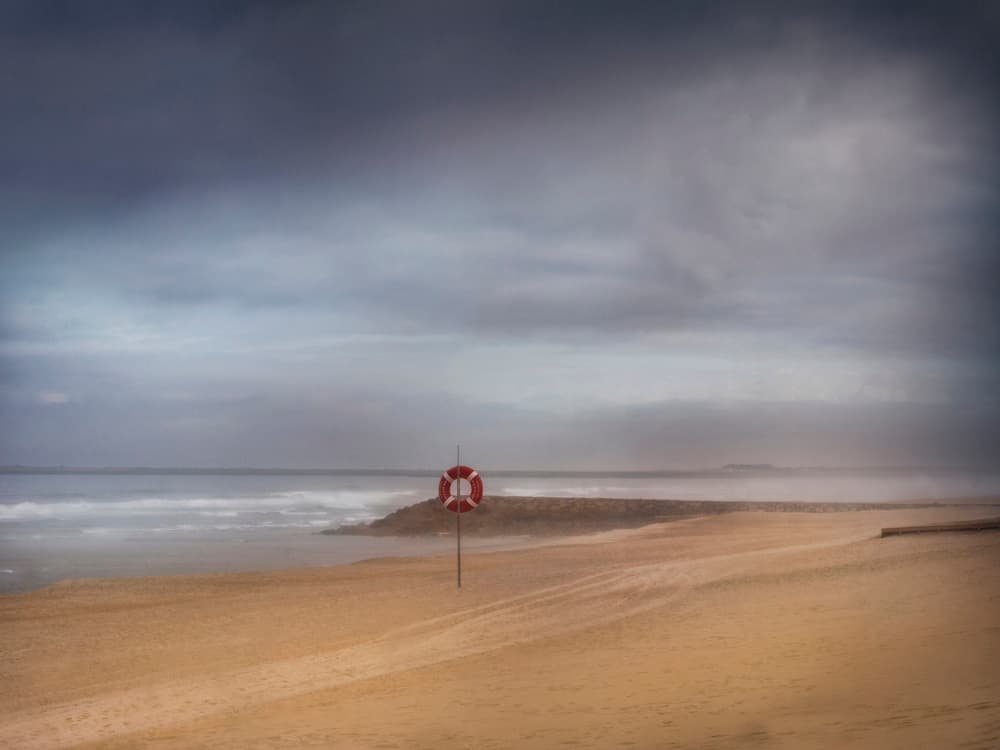 Misty Beach Lifebuoy by Giuseppe Satriani — canvas wall art