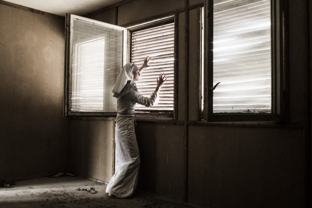 Nun Reaching for Light by Bogdan Bouşcă — canvas wall art