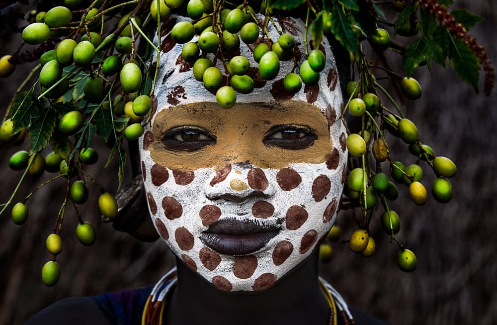 Vivid Tribal Face Adornment by Joxe Inazio Kuesta Garmendia — canvas wall art