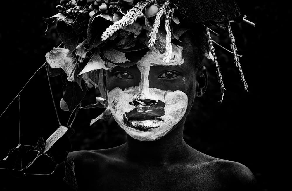 Painted Face Child by Joxe Inazio Kuesta Garmendia — canvas wall art