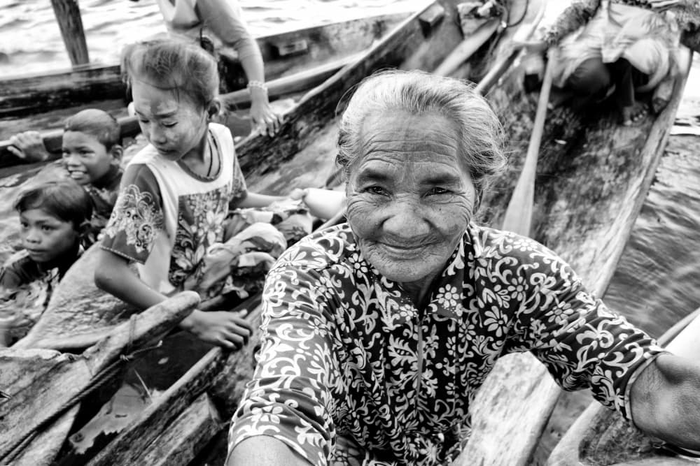 Smiling Elder on Boat by Kieron Long — canvas wall art