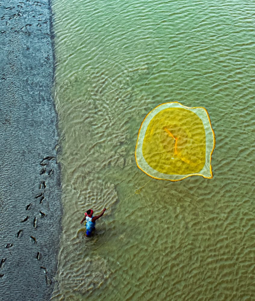 Fisherman Casting Net by Ajit Kumar Majhi — canvas wall art