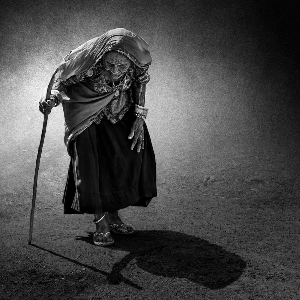 Elderly Woman's Shadow Walk by Fadhel Almutaghawi — canvas wall art