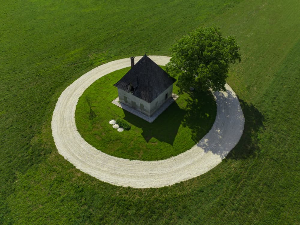 Isolated House Green Field by Jure Kravanja — canvas wall art