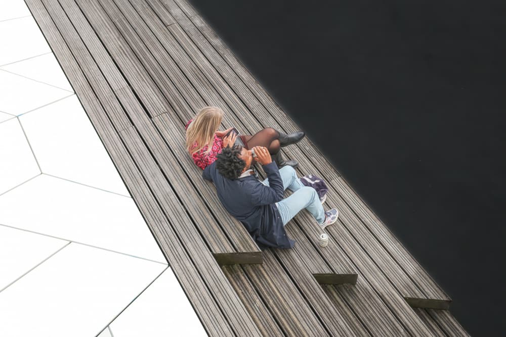 Urban Couple Relaxing by Bruno Flour — canvas wall art
