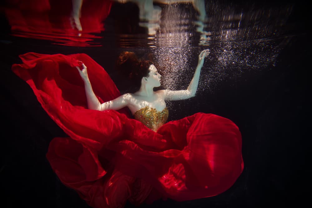 Floating Woman Red Dress by Gabriela Slegrova — canvas wall art