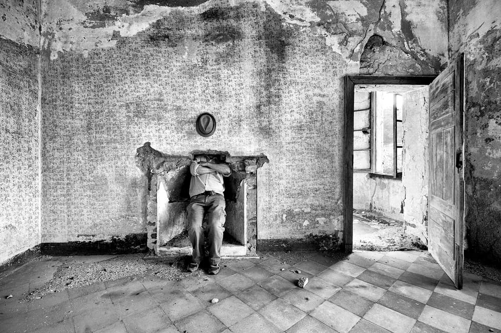Man in Abandoned Room by Carlo Ferrara — canvas wall art