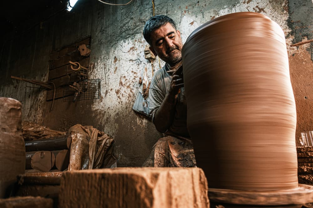 Artisan Potter Shaping Clay by Ali Ayer — canvas wall art