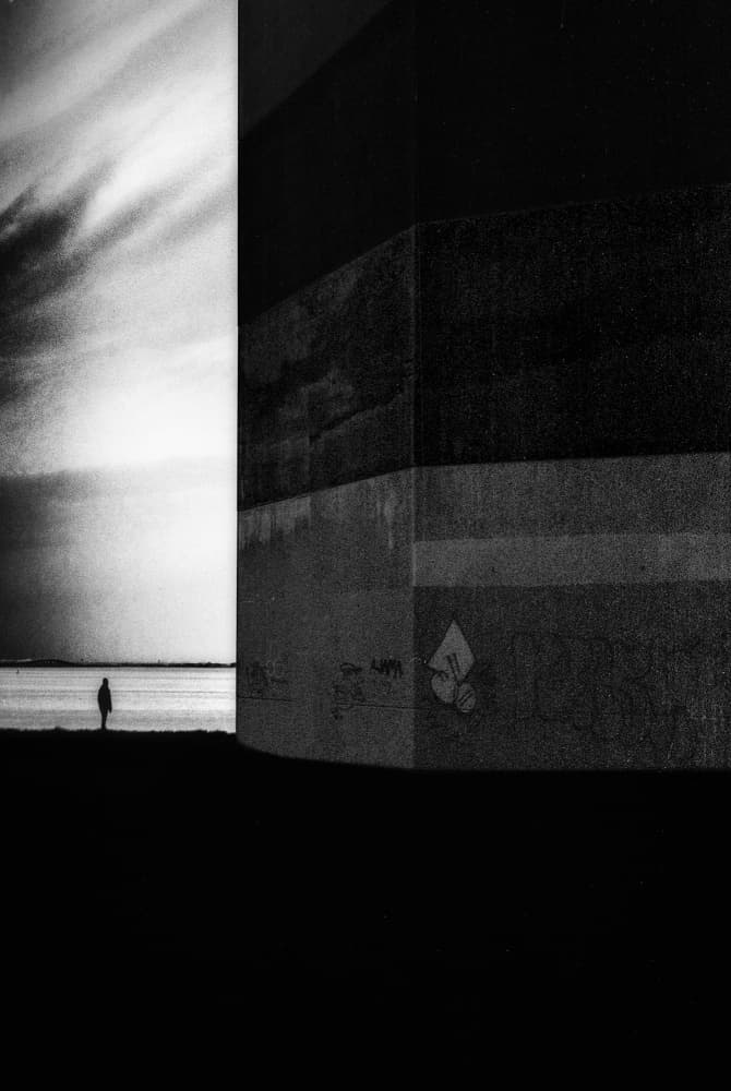 Solitary Shoreline Figure by Paulo Abrantes — canvas wall art