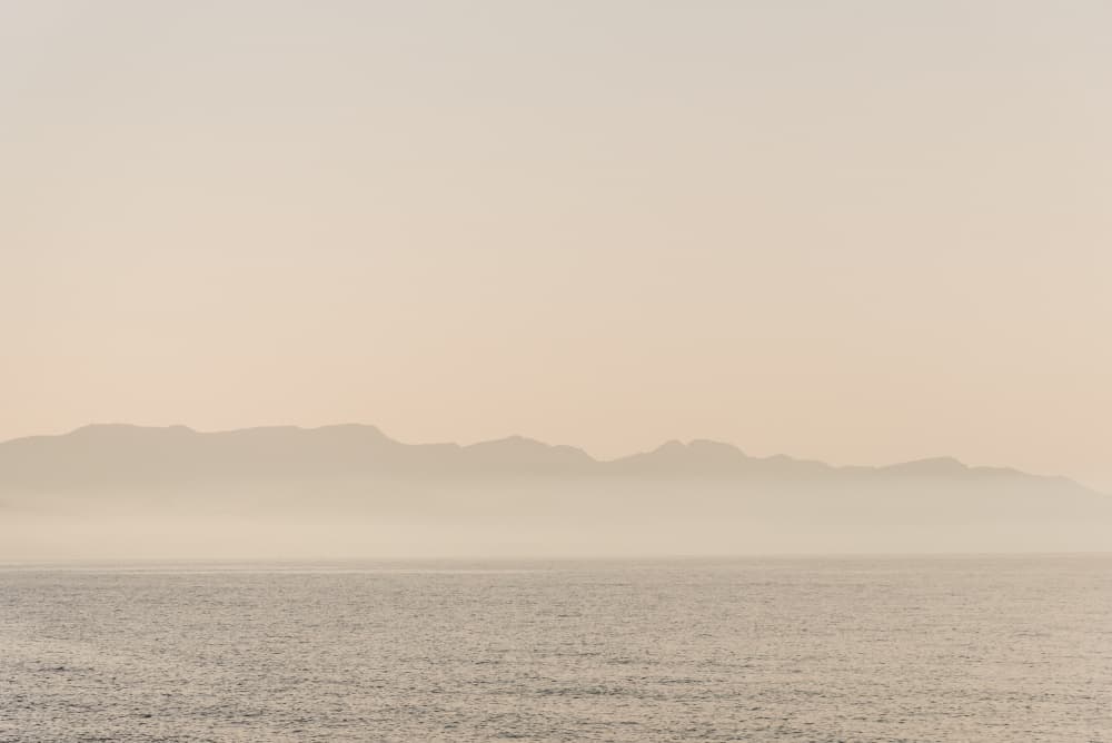 Calm Sea Misty Mountains by Photolovers — canvas wall art