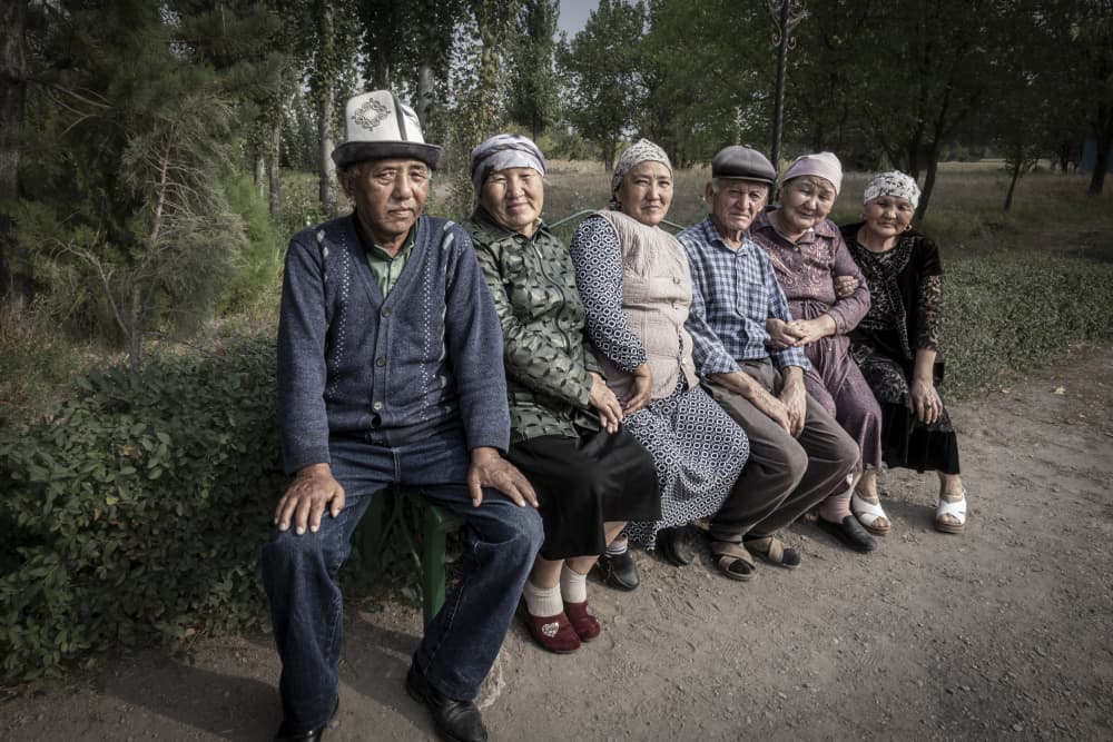 Smiling Elders Together by Elena Molina — canvas wall art