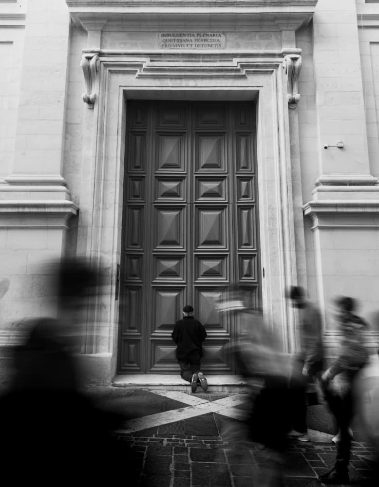 Kneeling at the Church Door by Martin Agius — canvas wall art