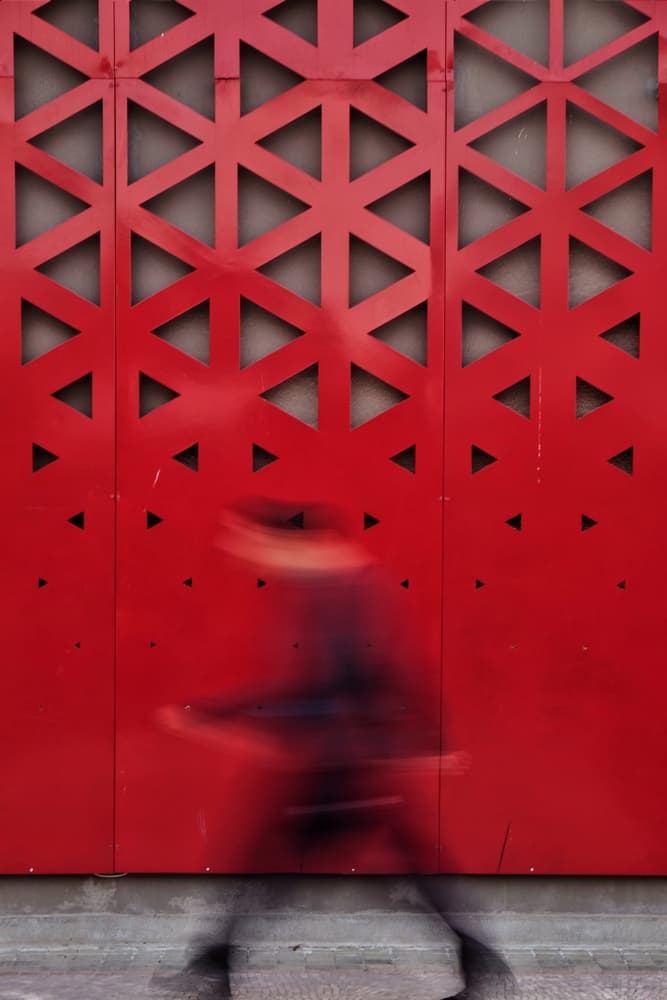 Blurred Motion Red Wall by Ali Ayer — canvas wall art