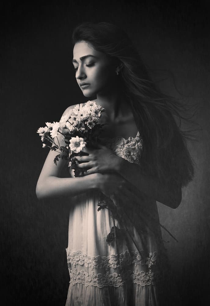 Pensive Woman With Flowers by Mehdi Mokhtari — canvas wall art
