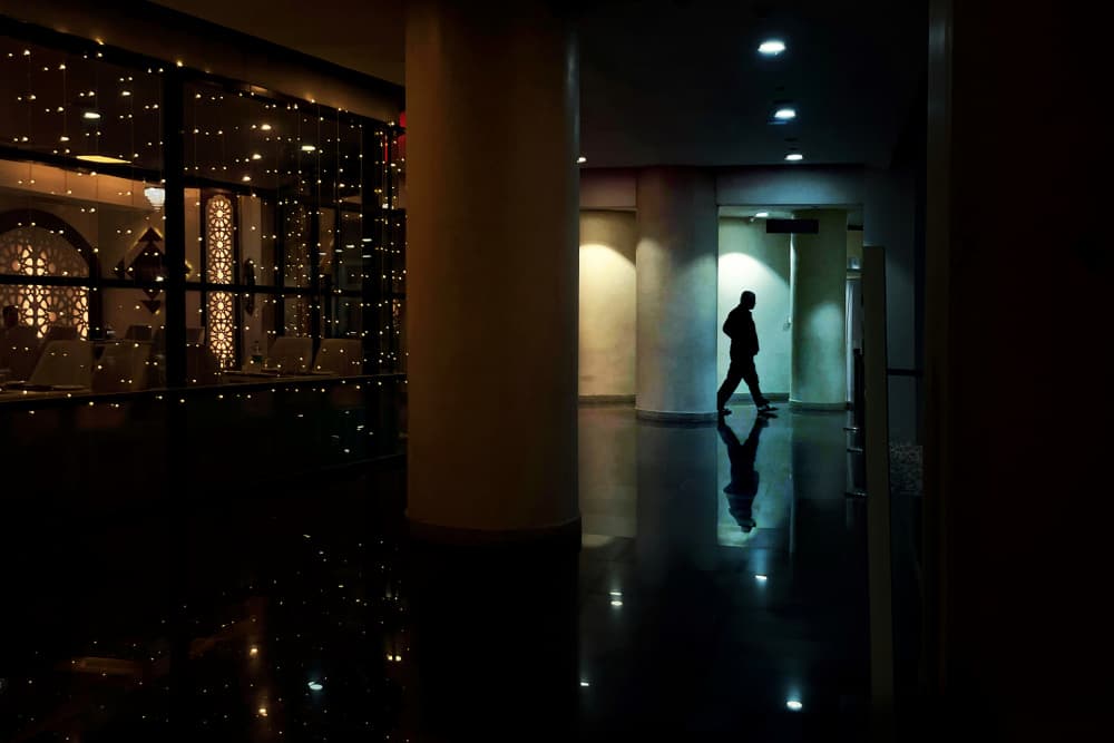 Reflective Hallway Silhouette by Kuntal Biswas — canvas wall art