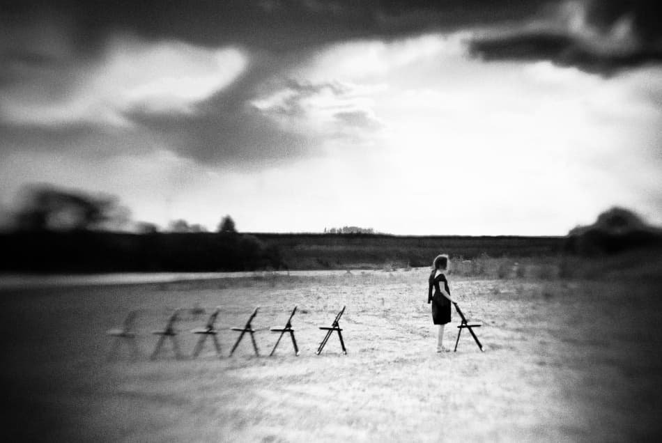 Solitary Girl Empty Chairs by Codrin Lupei — canvas wall art