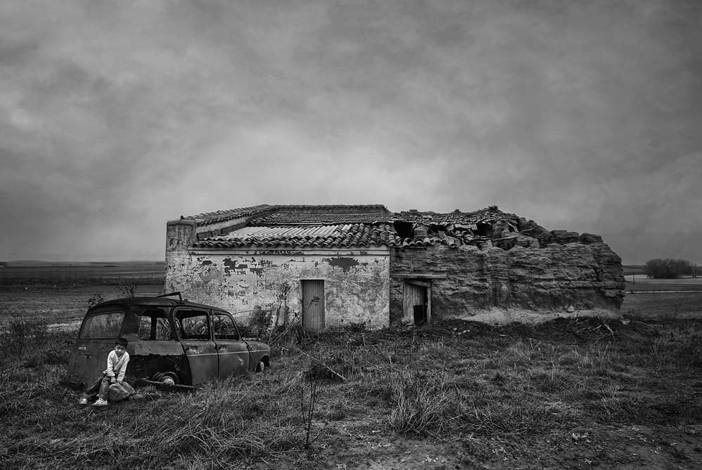 Boy in Abandoned Car by Jose C. Lobato — canvas wall art