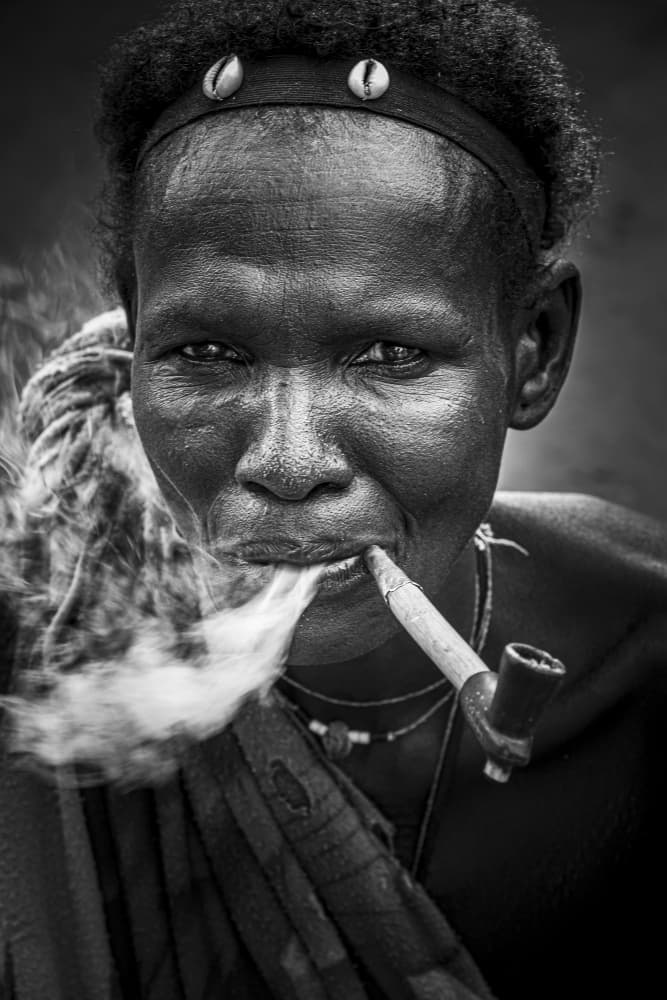 Tribal Woman Smoking Pipe by Elena Molina — canvas wall art