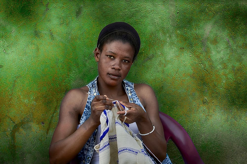 Woman Crocheting Green Wall by Sergio Pandolfini — canvas wall art