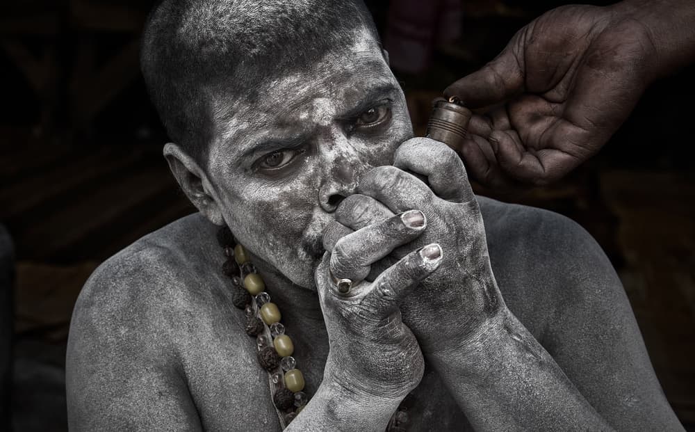 Ash-Covered Sadhu Smoking by Joxe Inazio Kuesta Garmendia — canvas wall art