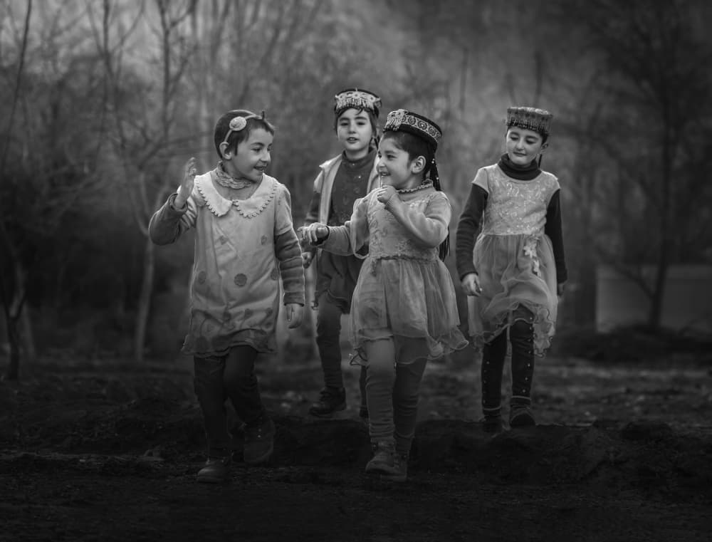 Children in Cultural Hats by Anna Zhang — canvas wall art