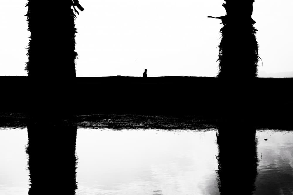 Solitary Figure Reflection by Ali Ayer — canvas wall art