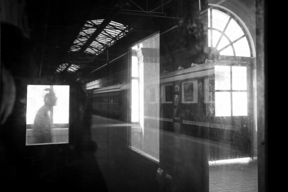 Moody Train Station Reflection by Ali Ayer — canvas wall art