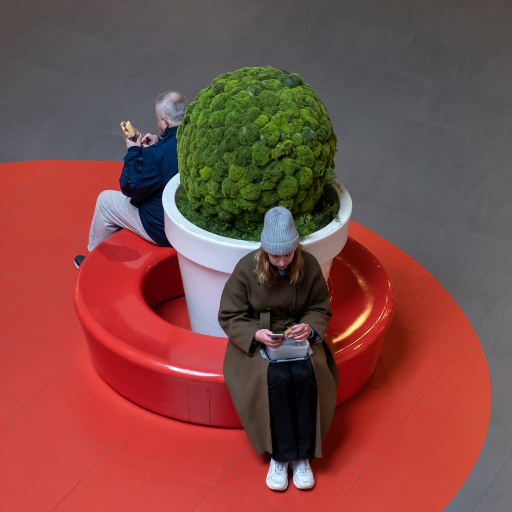 People on Red Seating by Lus Joosten — canvas wall art