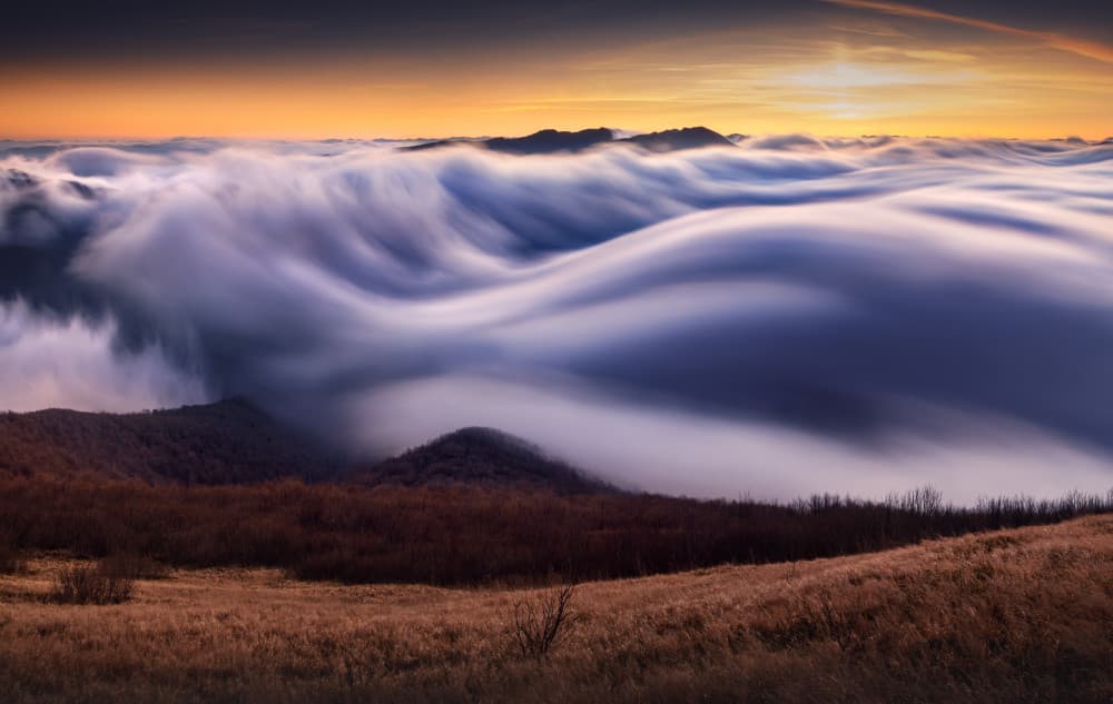 Flowing Clouds Over Peaks by Karol Nienartowicz — canvas wall art
